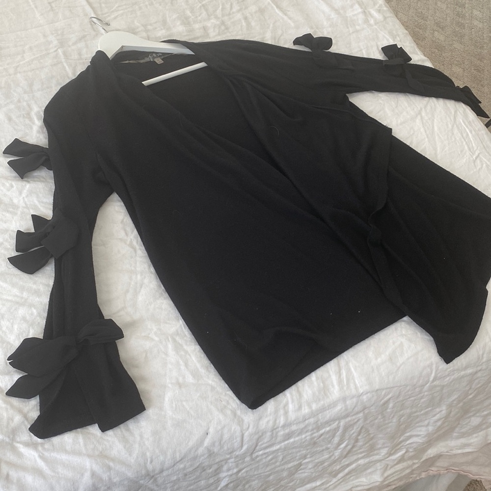 Black cascading cardigan with bow detail on sleeves